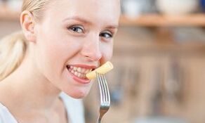 Girl eating pasta